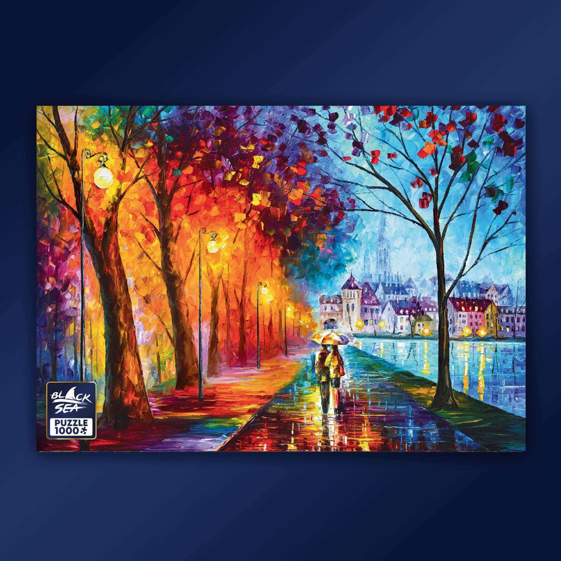 Puzzle Black Sea Premium 1000 pieces - Under the Rain, Leonid Afremov represents autumn as never before. It is colourful and warm, and the whole world is reflected in the streets, washed by the warm rain. Afremov’s unique style using a palette knife with